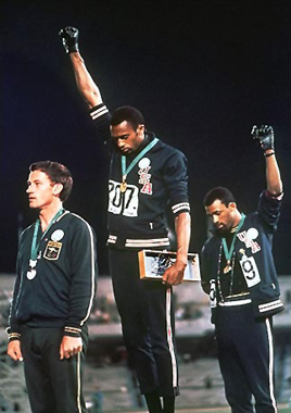Tommie Smith, John Carlos, and Peter Norman protest American and Australian White Supremacist policies, October 16, 1968, Mexico City Olympics. (AP Photographer via Wikimedia)